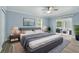 Comfortable main bedroom with a king-size bed, a ceiling fan, and sliding glass doors to a balcony at 911 Mendoza Ln, Kissimmee, FL 34758