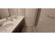 Bathroom featuring double sinks, modern fixtures, and a neutral color palette at 9414 Haber Ct, Orlando, FL 32827