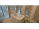 This bathroom has a soaking tub, glass shower, and tiled floors, combining luxury and functionality for a spa-like retreat at 9414 Haber Ct, Orlando, FL 32827