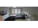 Bright bedroom with a plush rug, neutral tones, and ample natural light, offering a relaxing and inviting atmosphere at 9414 Haber Ct, Orlando, FL 32827