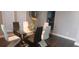 Chic dining room with a glass table, modern chairs, and plenty of natural light from the large windows at 9414 Haber Ct, Orlando, FL 32827