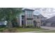 Beautiful home featuring manicured landscaping and a red front door at 9414 Haber Ct, Orlando, FL 32827