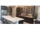 Modern kitchen featuring a large island with seating, stainless steel appliances, and sleek cabinetry at 9414 Haber Ct, Orlando, FL 32827