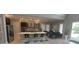 An open-concept kitchen with an island, seating, modern appliances, and ample natural light, offering a stylish and functional space at 9414 Haber Ct, Orlando, FL 32827