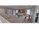 Open sitting room featuring a view of the neighborhood and sleek furniture at 9414 Haber Ct, Orlando, FL 32827