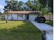 Charming single-story home featuring a well-maintained lawn and driveway at 946 Delano Ct, Kissimmee, FL 34758