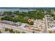 Aerial view of a residential area with tree-lined streets and a house with a red marker for location at 1009 S Ivey Ln, Orlando, FL 32811