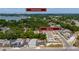 Aerial view of a residential area with tree-lined streets and a house with address and downtown Orlando at 1009 S Ivey Ln, Orlando, FL 32811