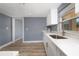 Modern kitchen featuring ample countertop space and stainless steel sink at 1009 S Ivey Ln, Orlando, FL 32811