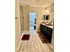 Bathroom with a glass enclosed shower and a dark wood vanity with dual sinks at 1016 Cascade Dr, Davenport, FL 33837