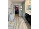Bathroom featuring dark wood vanity, attractive mirrors, and tiled flooring for a luxurious feel at 1016 Cascade Dr, Davenport, FL 33837