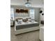 Modern bedroom featuring a large bed, stylish decor, and ample natural light from the windows at 1016 Cascade Dr, Davenport, FL 33837
