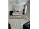 Cozy bedroom featuring a plush rug and a decorative bedframe with built-in storage drawers at 1016 Cascade Dr, Davenport, FL 33837
