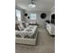 This bedroom features neutral tones, modern light fixture, plus a built-in bench and mini-fridge for extra comfort at 1016 Cascade Dr, Davenport, FL 33837