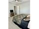 Cozy bedroom with natural lighting and views of greenery, providing a restful and inviting atmosphere at 1016 Cascade Dr, Davenport, FL 33837