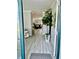 Elegant entryway with hardwood floors and a view into the stylishly decorated living area at 1016 Cascade Dr, Davenport, FL 33837