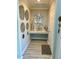 Hallway with decorative wall art and modern flooring at 1016 Cascade Dr, Davenport, FL 33837