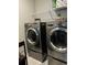 Clean laundry room with LG washer and dryer and shelving for storage at 1016 Cascade Dr, Davenport, FL 33837