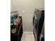 Convenient laundry area featuring a modern washer and laundry detergent dispenser at 1016 Cascade Dr, Davenport, FL 33837