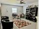 Stylish living room boasting custom bar, with comfortable seating for relaxation and entertaining at 1016 Cascade Dr, Davenport, FL 33837