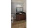 Bathroom features a dark vanity, a large mirror, modern fixtures and neutral tones at 1023 S Hiawassee Rd # 4017, Orlando, FL 32835