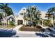 Welcoming clubhouse showcasing an inviting entrance, lush landscaping, and distinctive architectural details at 1023 S Hiawassee Rd # 4017, Orlando, FL 32835
