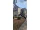 Tan two-story exterior with stairway, complemented by a mature palm tree and ground cover at 1023 S Hiawassee Rd # 4017, Orlando, FL 32835