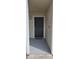 A solid black front door is framed by white trim, creating a clean and inviting entrance at 1023 S Hiawassee Rd # 4017, Orlando, FL 32835