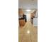 A functional kitchen with granite counters, wood cabinets and tile floor at 1023 S Hiawassee Rd # 4017, Orlando, FL 32835