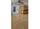 Open-concept living and kitchen area with tile flooring, natural light, and balcony access at 1023 S Hiawassee Rd # 4017, Orlando, FL 32835