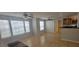 Bright living room featuring tile floors, ceiling fans, and natural light from large windows at 1023 S Hiawassee Rd # 4017, Orlando, FL 32835