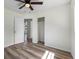 Light and bright bedroom with luxury vinyl floors, closet and ceiling fan at 120 & 0 8Th Wahneta W St, Winter Haven, FL 33880