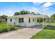 View of home with a covered carport featuring a well-maintained yard at 120 & 0 8Th Wahneta W St, Winter Haven, FL 33880