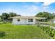 View of home featuring a well-maintained yard and simple design at 120 & 0 8Th Wahneta W St, Winter Haven, FL 33880