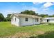 Charming single-story home featuring a well-maintained lawn and a simple, classic design at 120 & 0 8Th Wahneta W St, Winter Haven, FL 33880