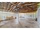 Large unfinished garage with a high ceiling with exposed rafters and white walls at 120 & 0 8Th Wahneta W St, Winter Haven, FL 33880