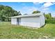 Outdoor shed with a metal roof and white siding situated in the backyard at 120 & 0 8Th Wahneta W St, Winter Haven, FL 33880