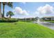 Manicured backyard landscape with water and fountain views at 1225 Bella Cara Ct # 1, Davenport, FL 33896