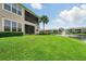 A wide angle view of lush green backyard facing towards the water at 1225 Bella Cara Ct # 1, Davenport, FL 33896