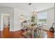 Bright dining area featuring a chandelier, dining table set, and decorative wall oars at 1225 Bella Cara Ct # 1, Davenport, FL 33896