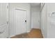 Inviting hallway with multiple doors, neutral paint, and tile flooring providing ample storage at 1225 Bella Cara Ct # 1, Davenport, FL 33896