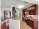 Modern kitchen featuring stainless steel appliances, granite countertops, and open layout to living spaces at 1225 Bella Cara Ct # 1, Davenport, FL 33896