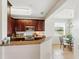 Eat-in kitchen featuring granite countertops, stainless steel appliances, and natural light at 1225 Bella Cara Ct # 1, Davenport, FL 33896