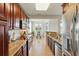 Modern kitchen with granite countertops, stainless steel appliances and views to the breakfast area and pond at 1225 Bella Cara Ct # 1, Davenport, FL 33896