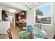 Kitchen and breakfast nook features granite countertops, stainless steel appliances and glass table overlooking a tropical view at 1225 Bella Cara Ct # 1, Davenport, FL 33896