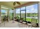 Screened-in lanai with seating area overlooks the pond and fountain, plus a breakfast nook on the side at 1225 Bella Cara Ct # 1, Davenport, FL 33896