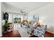 Stylish living room featuring comfortable seating, a ceiling fan, and picturesque views of the water at 1225 Bella Cara Ct # 1, Davenport, FL 33896