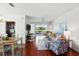Bright living room boasts hardwood floors, slider to deck, comfortable seating, and stylish decor at 1225 Bella Cara Ct # 1, Davenport, FL 33896