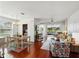 Open-concept living room and dining area with hardwood floors and plenty of natural light at 1225 Bella Cara Ct # 1, Davenport, FL 33896