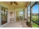 Enclosed patio with ceiling fan and view to a dining room and outdoor water feature at 1225 Bella Cara Ct # 1, Davenport, FL 33896